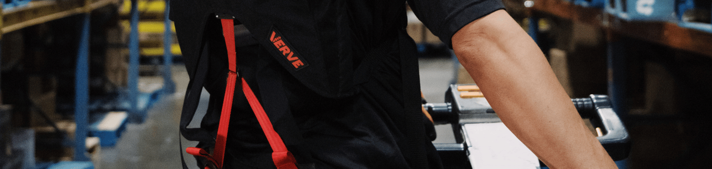 Close-up of a SafeLift exosuit on a distribution worker's back.
